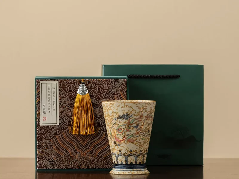 The Nine-Colored Deer hand-painted porcelain cup with its presentation box