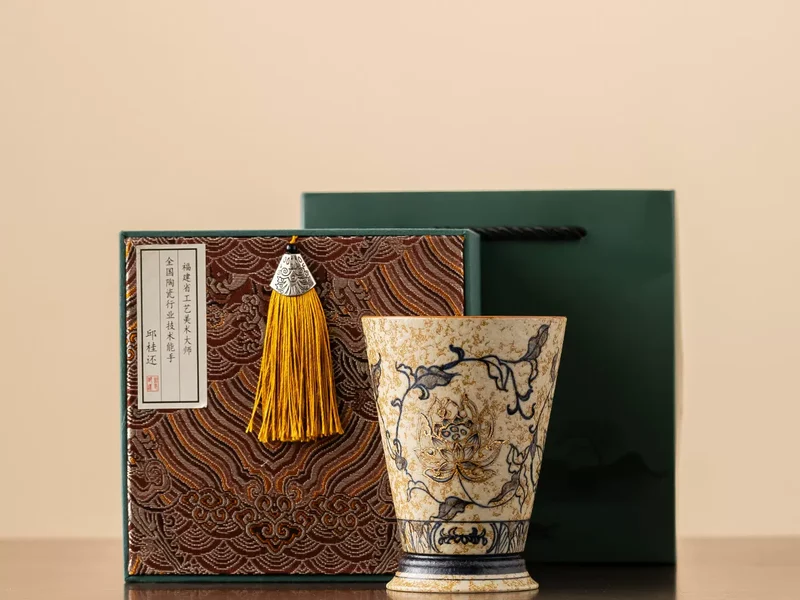 The Trailing Lotus hand-painted porcelain cup with its presentation box